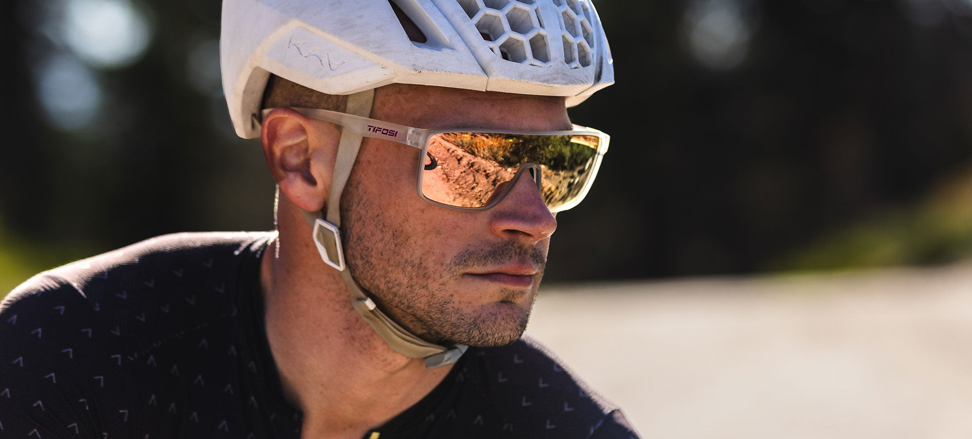 Man wear Tifosi Sanctum Cycling Sunglasses while out on a ride