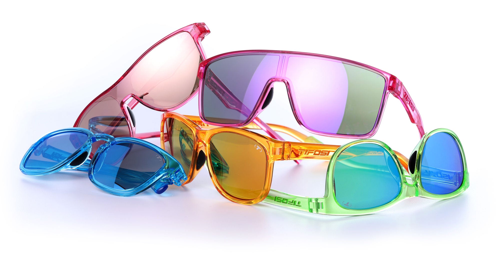 Group of neon lights sunglasses sitting in an organized pile
