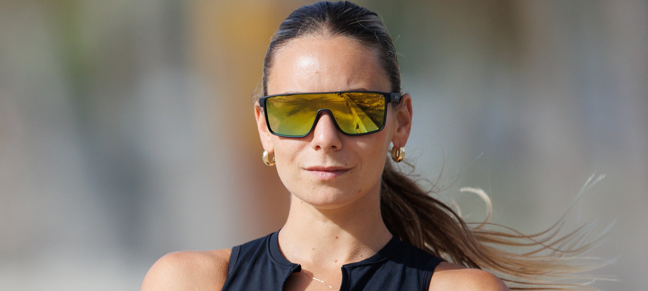 Woman wearing Sanctum matte black smoke yellow