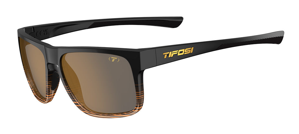 Black sunglasses with orange accents on a white background, featuring the Tifosi logo.