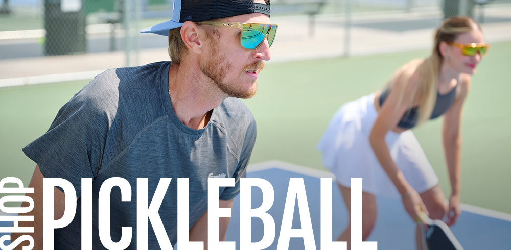 Two people playing pickleball on a court with text overlay