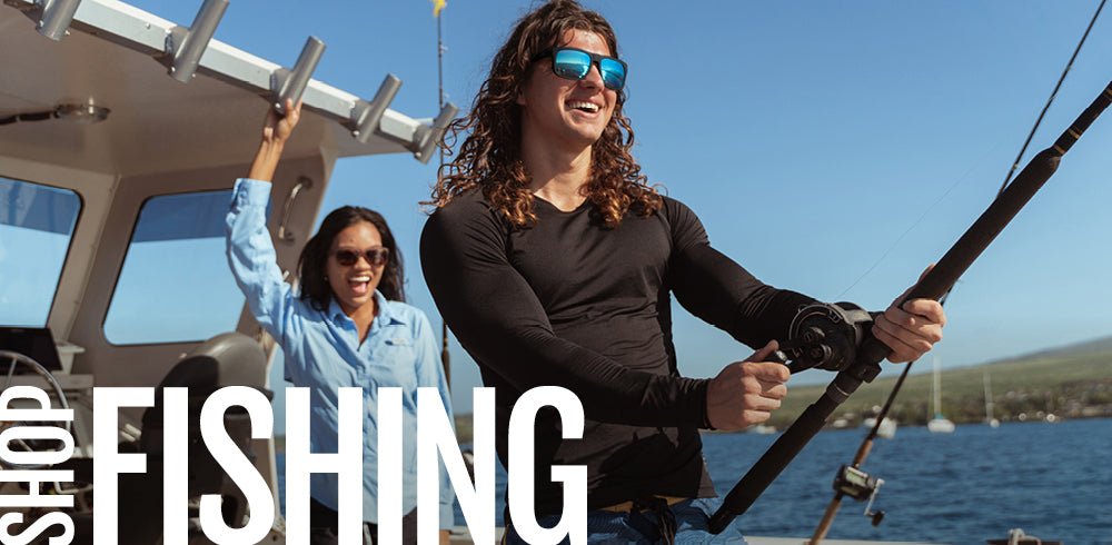 Two people on a boat with one holding a fishing rod and the word 'Fishing' displayed.