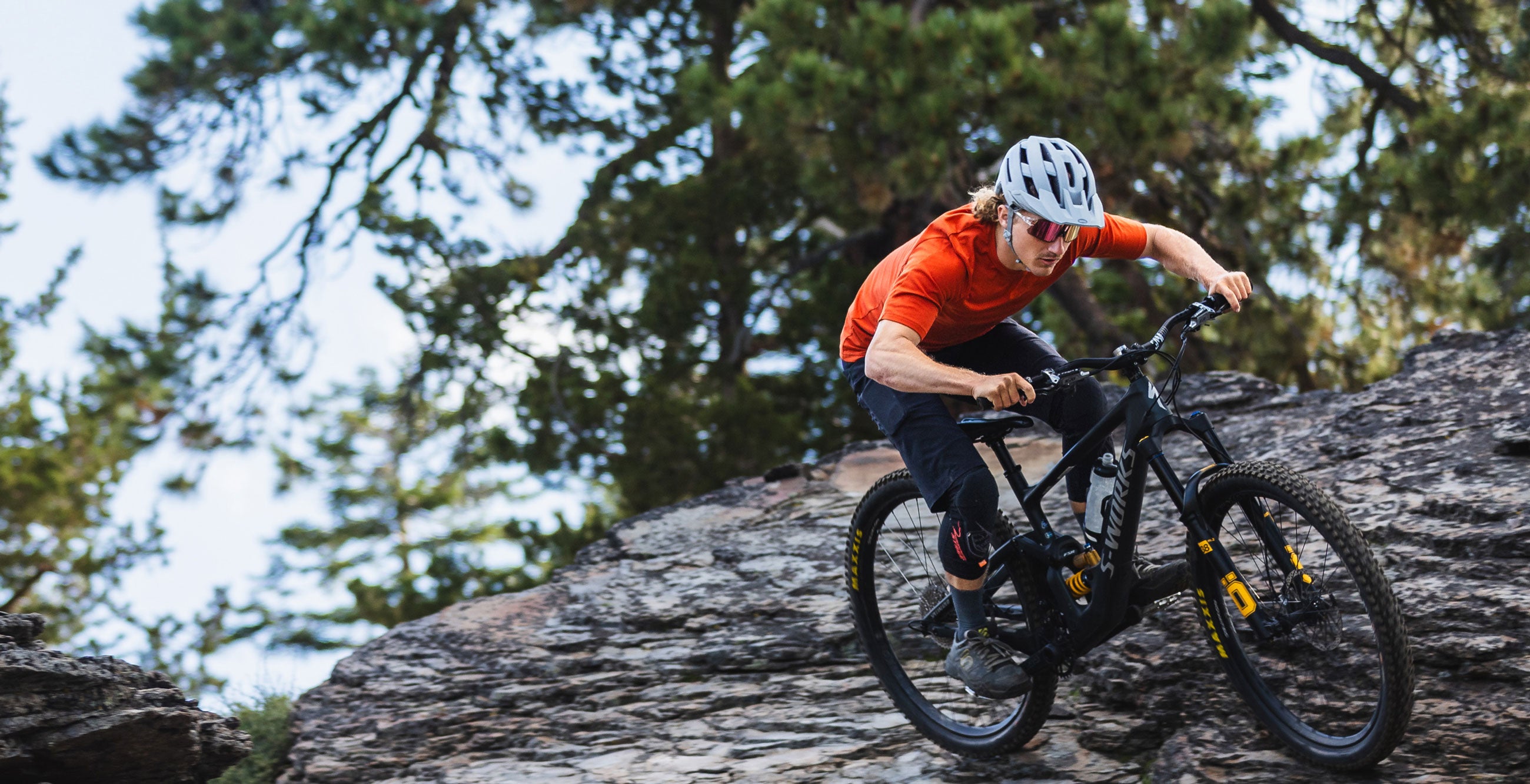 Man riding a bike on a mountain side