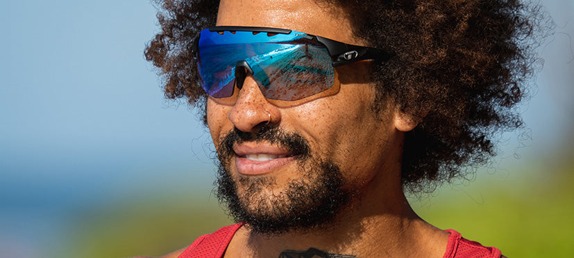 Male wearing Sledge Lite clarion blue fototec photochromic sport sunglasses