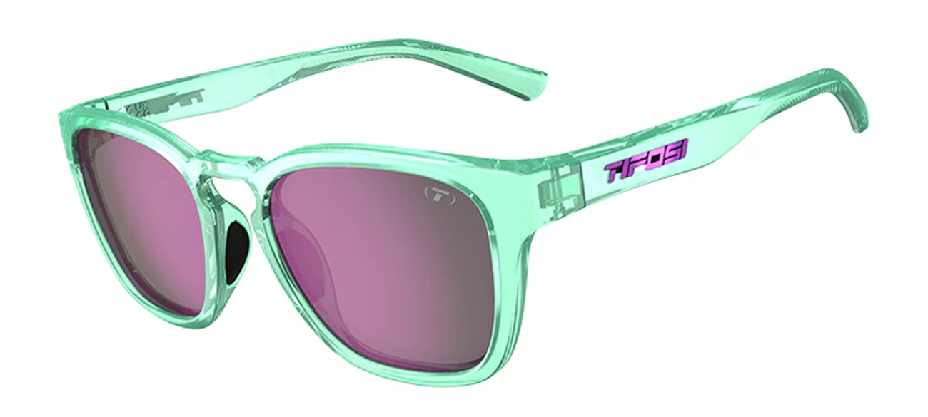 A pair of Smirk sport sunglasses with a green full frame, teardrop-shaped lenses, and pink accents on the arms.