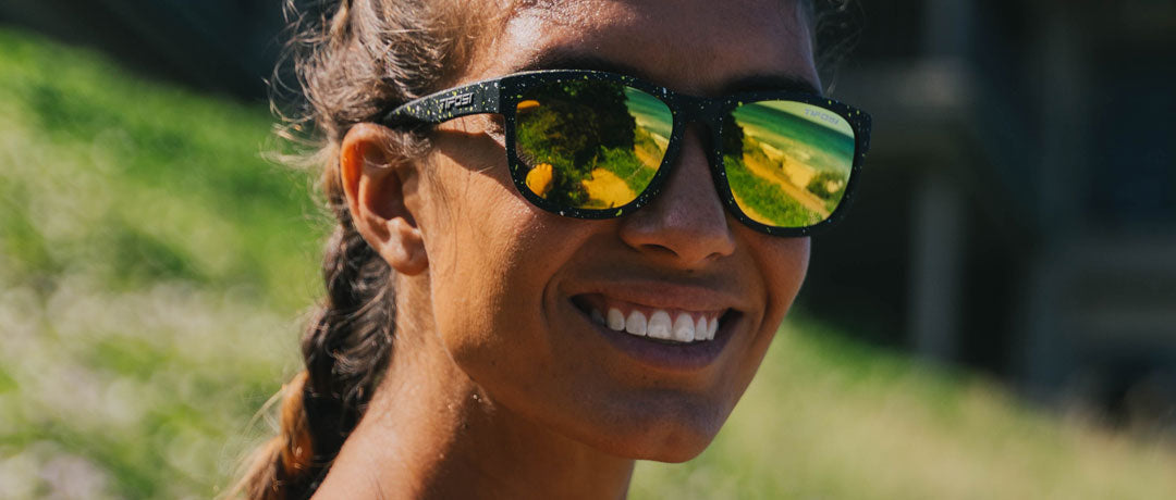 Female wearing Swank XL cosmic black with smoke yellow lens