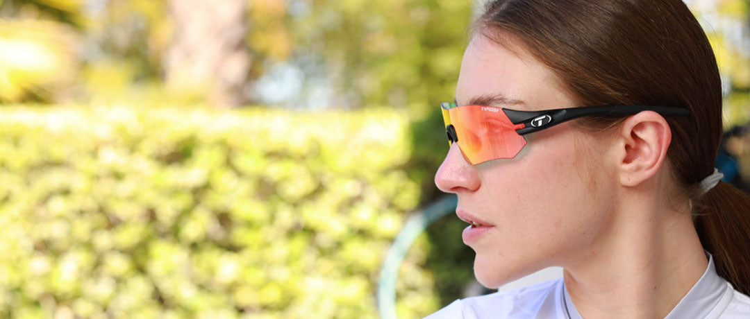 Female wearing Tsali Matte Black with Clarion Red Fototec lens