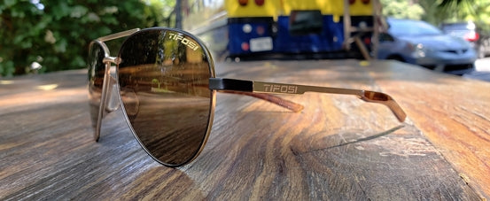 shwae midnight gold brown aviator sunglass outdoors