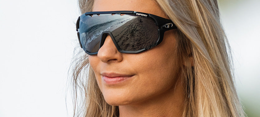 Female wearing Sledge sport sunglass in matte black with smoke lens