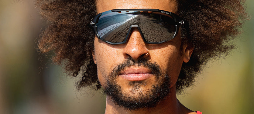 Male wearing Sledge sport sunglass in matte black with smoke lens