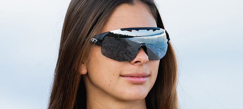 Female wearing Sledge Lite in matte black with smoke lens
