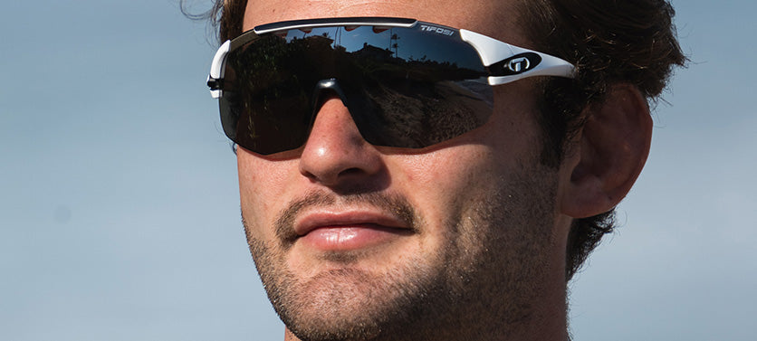 Male wearing Sledge Lite in matte white with smoke lens