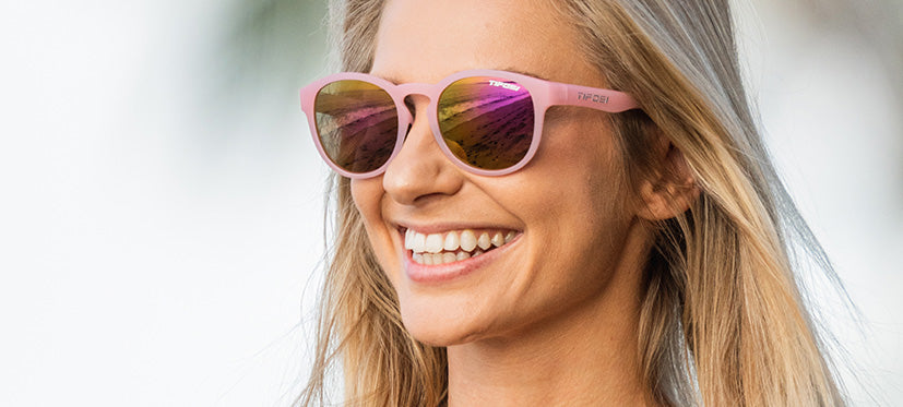 Female wearing Svago satin crystal blush lifestyle sport sunglasses