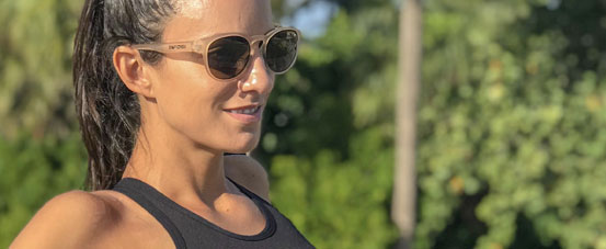 female wearing Svago lifestyle sport sunglasses in satin crystal brown