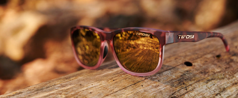 Swank XL matte pink tortoise sunglasses in the woods