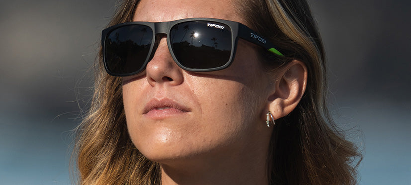 female wearing Swick satin black neon sunglasses