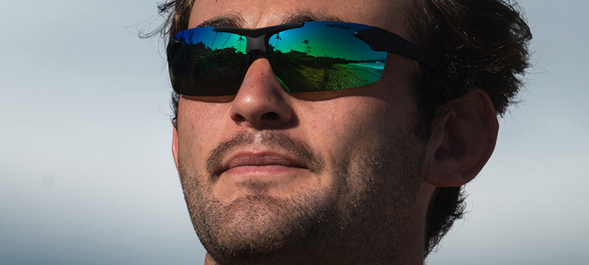 Male wearing Track blackout with emerald green lenses