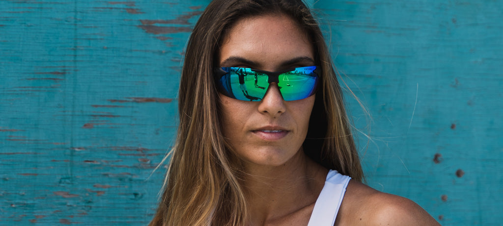 Female runner wearing Track blackout with smoke green lenses