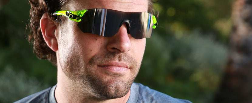 Male wearing Tsali Neon Green sunglass with Smoke lens