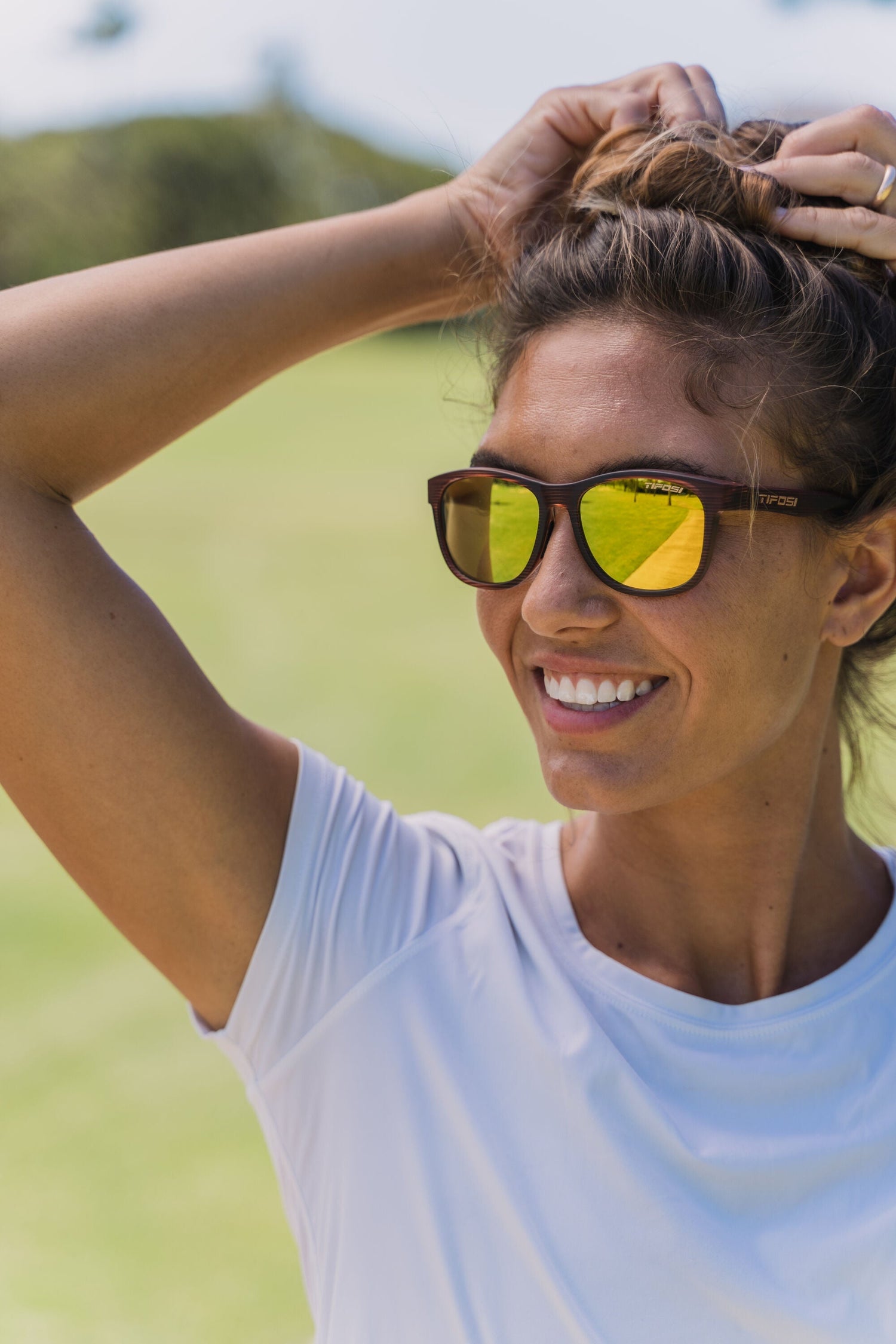 Woman wearing Tifosi sunglasses