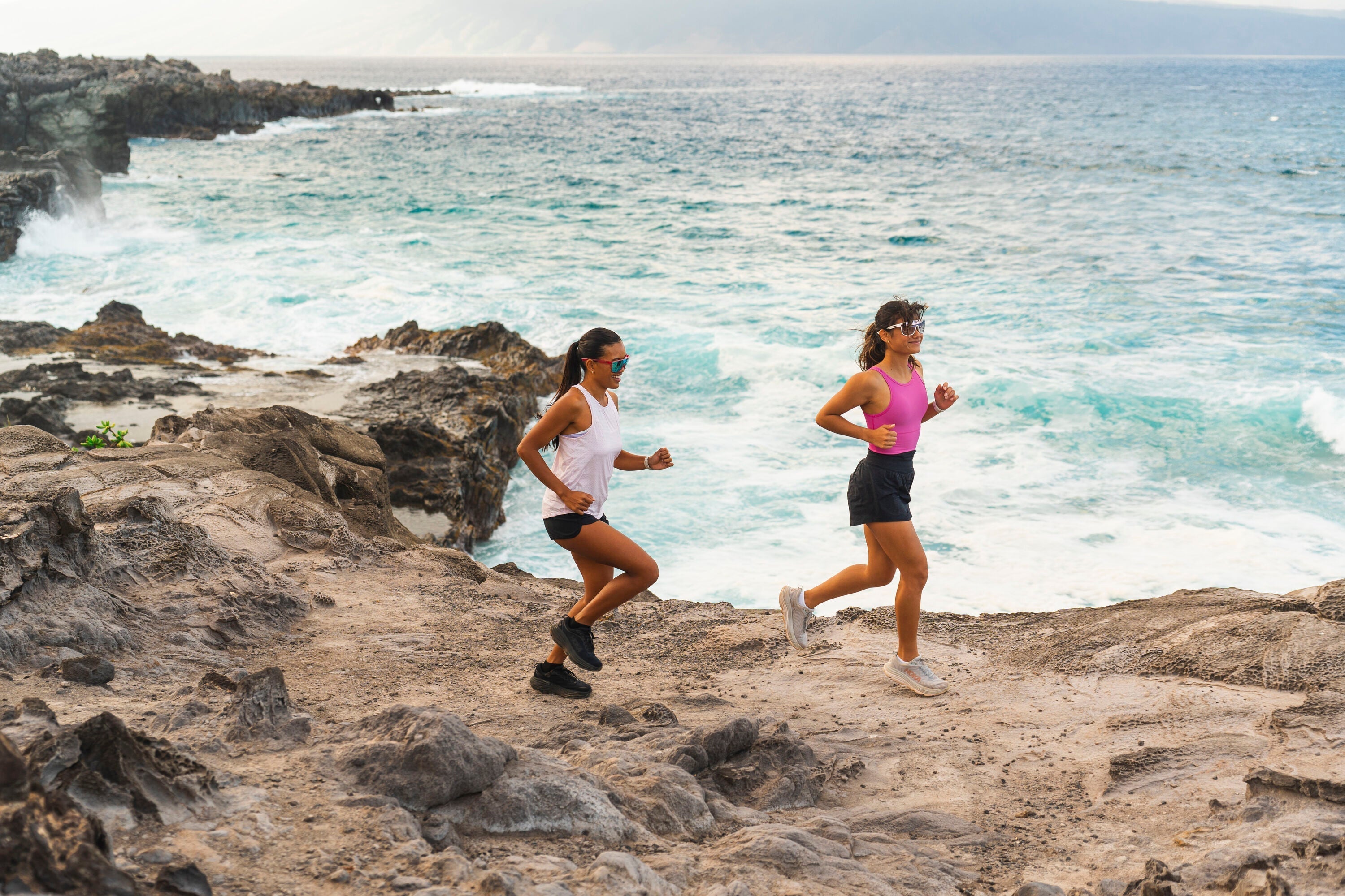 Two women running in Tifosi sunglasses