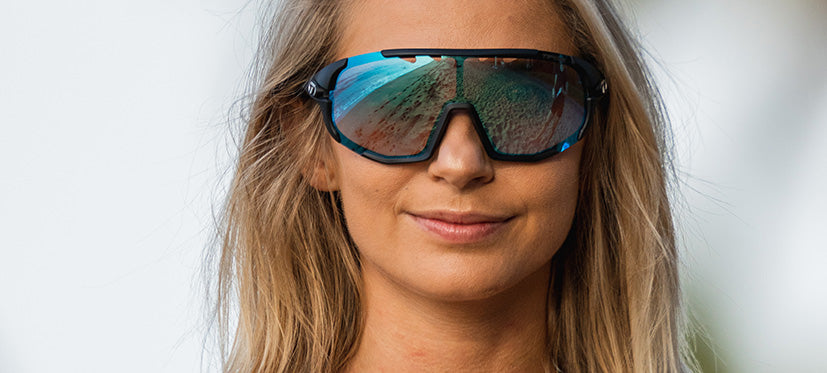 Female wearing Sledge clarion blue fototec photochromic sport sunglasses