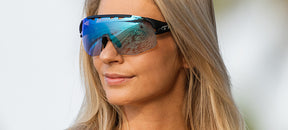 Female wearing Sledge Lite clarion blue fototec photochromic sport sunglasses