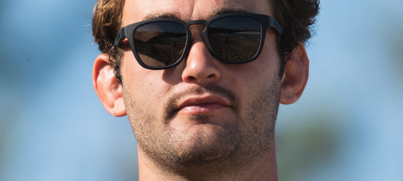 male wearing Smirk sport sunglass in blackout