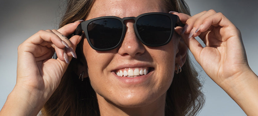 female wearing Smirk polarized sport sunglass in blackout