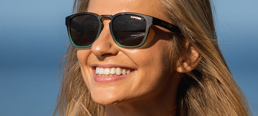 female wearing Smirk sport sunglass in matte blue tortoise