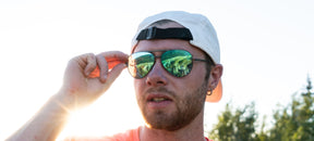 Male wearing Shwae graphite aviator sunglasses