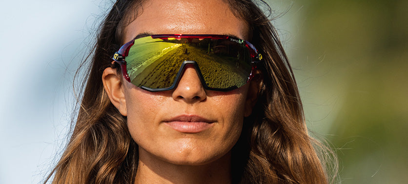 Female wearing Sledge sport sunglass in crystal red with clarion yellow lens