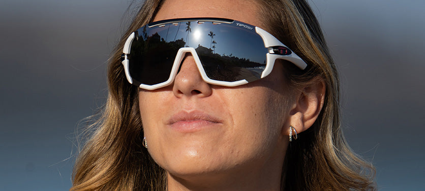 Female wearing Sledge sport sunglass in matte white with smoke lens