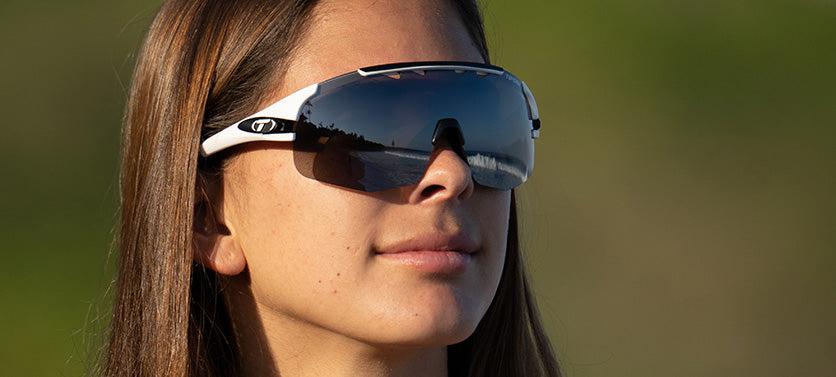 Female wearing Sledge Lite in matte white with smoke lens