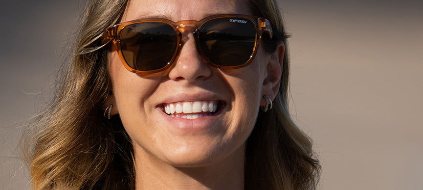 female wearing Smirk sport sunglass in honey