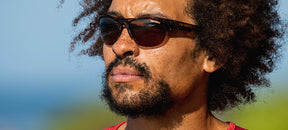 Male wearing Strikeout sport sunglasses in blue tortoise