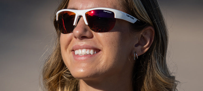 Female wearing Strikeout sport sunglasses in matte white
