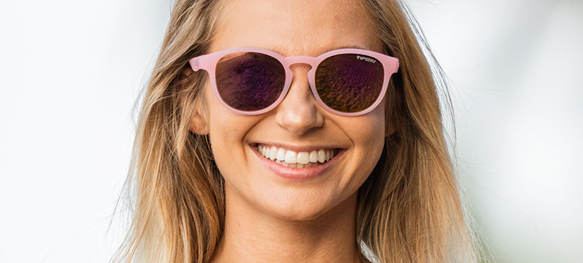 Female wearing Svago satin crystal blush lifestyle sport sunglasses