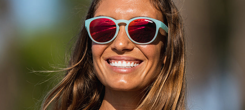 Female wearing Svago satin crystal teal lifestyle sport sunglasses