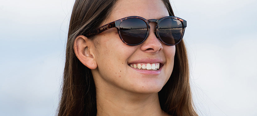 Female wearing tortoise lifestyle sport sunglasses