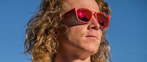 Male wearing Swank XL rave red sunglasses