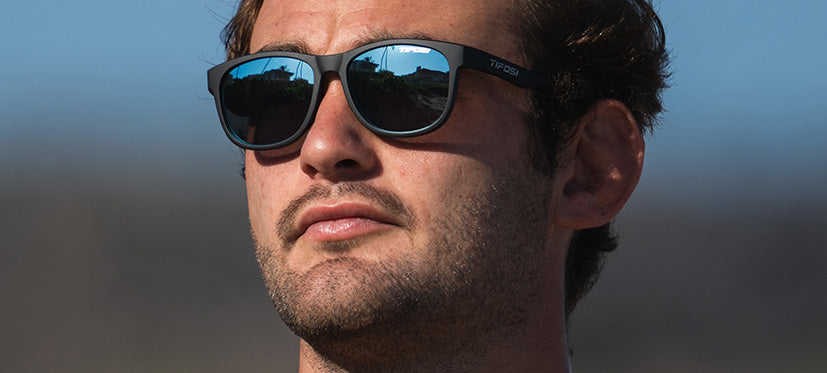 Male wearing Swank satin black sunglasses with smoke bright blue lenses