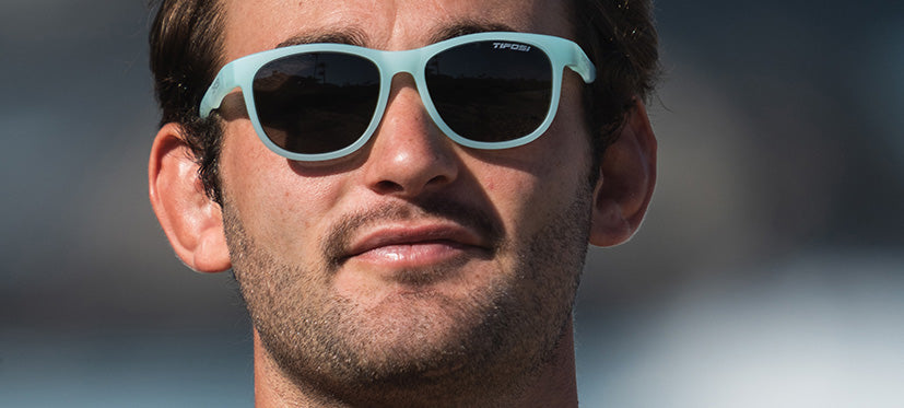 male wearing Swank satin crystal teal sunglasses