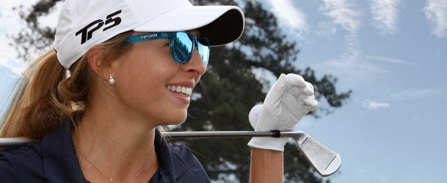 Female golfer wearing Swank crystal sky blue sunglasses