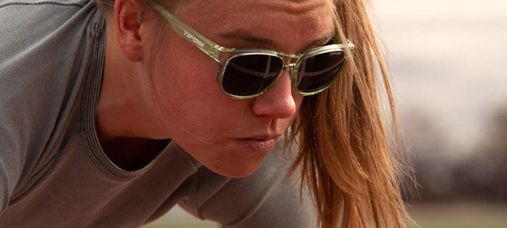 Female runner wearing Swank bottle green sunglasses