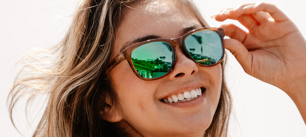 Female wearing Swank crystal brown sunglasses