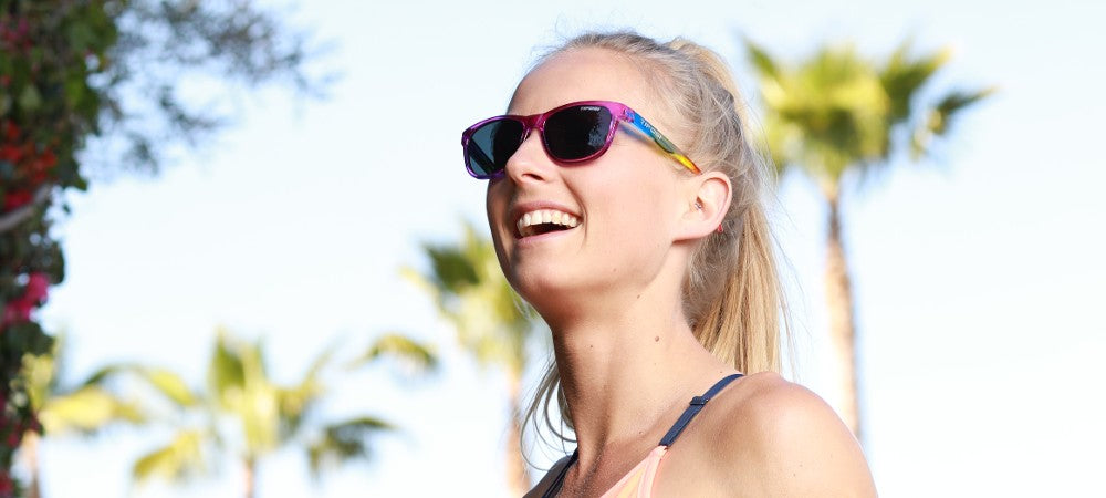 Female runner wearing Swank rainbow shine sunglasses