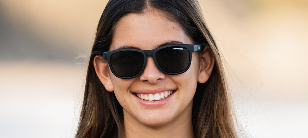 Female wearing Swank satin black sunglasses