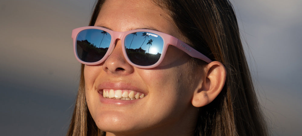 Female wearing Swank satin crystal blush sunglasses