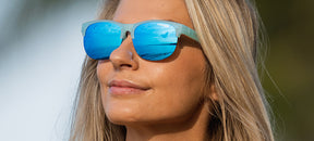 Female wearing Swank SL Satin Crystal Teal sunglasses